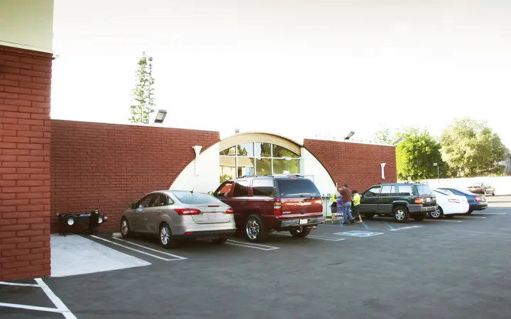 Free parking lot beside the arched laundromat entrance