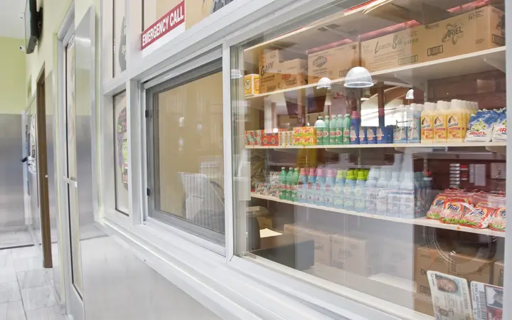 The supplies window stocked with detergent and laundry products