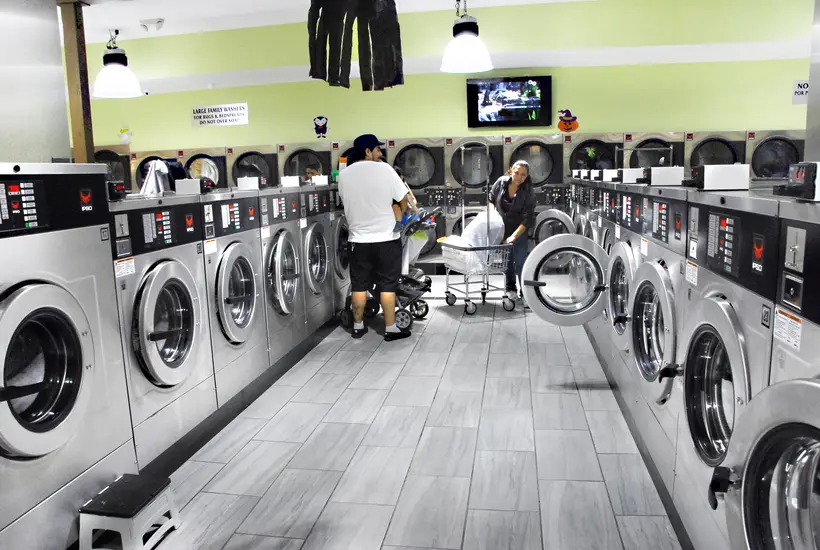Customers doing laundry inside Rio
