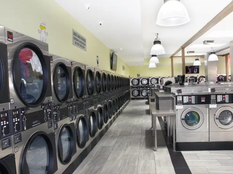 Rows of brand-new stacked dryers inside Rio Laundromat